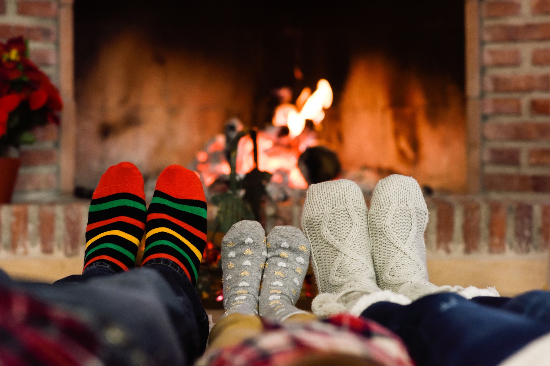 Warm glowing wood fire in a stone fireplace in a Teton County mountain home
